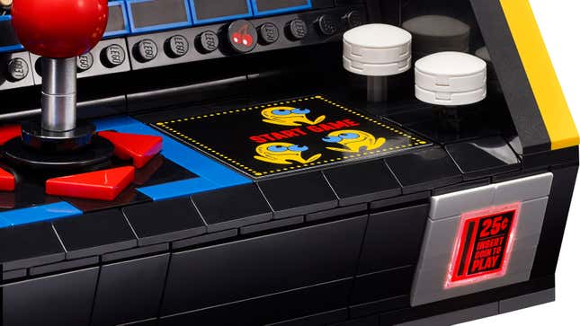 A close-up of the 'Start Game' buttons and illuminated coin slot on the Lego Pac-Man Arcade Machine Set.