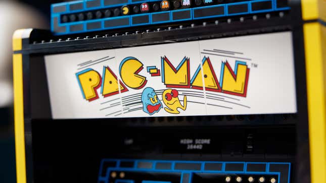 A close-up of the Lego Pac-Man Arcade Machine Set's marquee featuring vintage cabinet graphics.